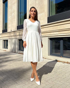 Rochie cununie civila midi cu mâneci lungi, decolteu elegant și design evazat.
