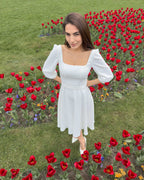 Rochie alba midi evazata cu maneci trei sferturi